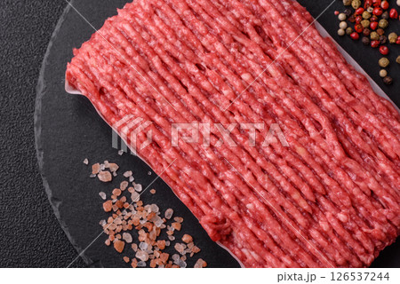Raw ground beef or pork with salt and spices 126537244