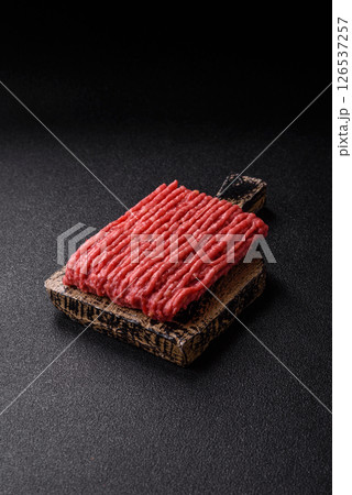 Raw ground beef or pork with salt and spices 126537257