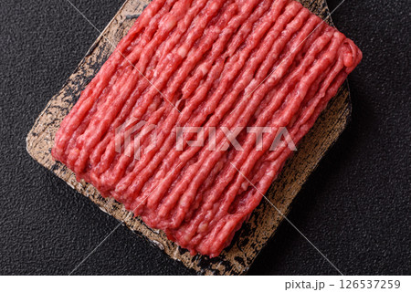 Raw ground beef or pork with salt and spices 126537259