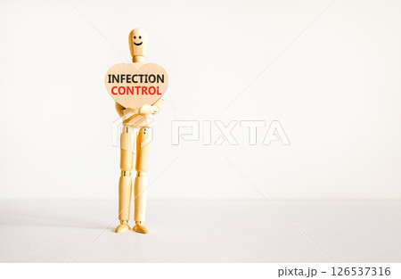 Infection control symbol. Concept words Infection control on beautiful wooden heart. Doctor's model. Beautiful white background. Copy space. Medical healthy lifestyle infection control concept. Infection control symbol. Concept words Infection control on beautiful wooden heart. Doctor's model. Beautiful white background. Copy space. Medical healthy lifestyle infection control concept. 126537316
