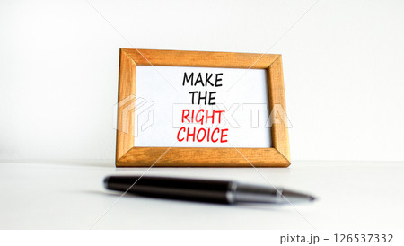 Make the right choice symbol. Concept words phrase Make the right choice on beautiful wooden picture frame. Black pen. Beautiful white background. Business Make the right choice concept. Copy space. Make the right choice symbol. Concept words phrase Make the right choice on beautiful wooden picture frame. Black pen. Beautiful white background. Business Make the right choice concept. Copy space. 126537332