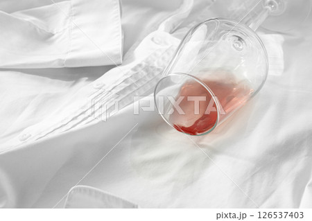 Glass, with pink wine, spilled on a white shirt, close-up, selective focus, no people, concept, top view, Glass, with pink wine, spilled on a white shirt, close-up, selective focus, no people, concept, top view, 126537403