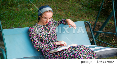 Pretty girl reading a book Pretty girl reading a book 126537662