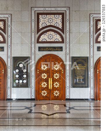The entrance of Jame' Asr Hassanil Bolkiah Mosque, in Brunei, features ornate wooden doors and stunning geometric patterns 126537883