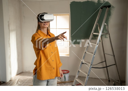Woman using virtual reality for home renovation Woman using virtual reality for home renovation 126538013
