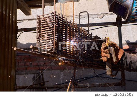 Welding Sparks Are Flying High as Metalwork Beautifully Takes Shape in the Workshop Welding Sparks Are Flying High as Metalwork Beautifully Takes Shape in the Workshop 126538508