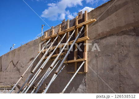 A construction scene showcasing the intricate framework and robust supports in place A construction scene showcasing the intricate framework and robust supports in place 126538512