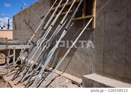 A construction scene showcasing the intricate framework and robust supports in place 126538513