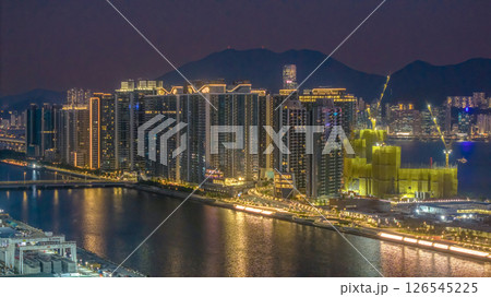 May 12 2025 Illuminated City Landscape with Full Moon and River 126545225