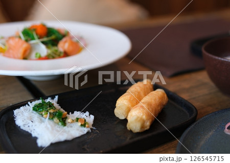 meat on wooden skewers salmon salad and rice vermicelli Grilled Barbecue Meats And Seafoods In Wooden Skewers On Street Market In Bali, Indonesia. Tracking Shot 126545715