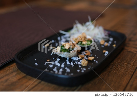 Ocean Clam Baked stuffed clams Baked stuffed fresh mussels in shell. to take food out of a shell with a fork Ocean Clam Baked stuffed clams Baked stuffed fresh mussels in shell. to take food out of a shell with a fork 126545716