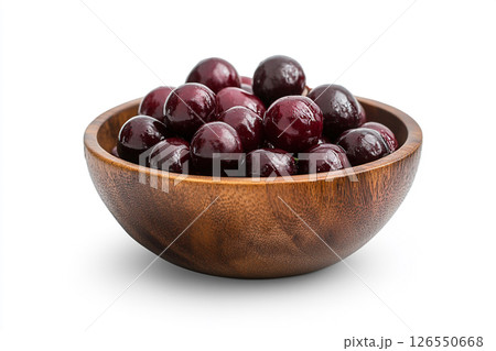 A wooden bowl filled with fresh, dark red cherries, each covered in water droplets, creating a visually appealing and appetizing image. 126550668