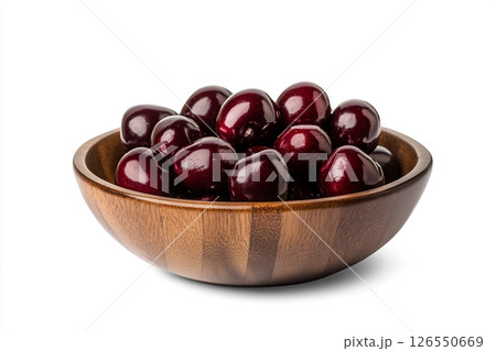 A wooden bowl filled with fresh, dark red cherries, each covered in water droplets, creating a visually appealing and appetizing image. 126550669