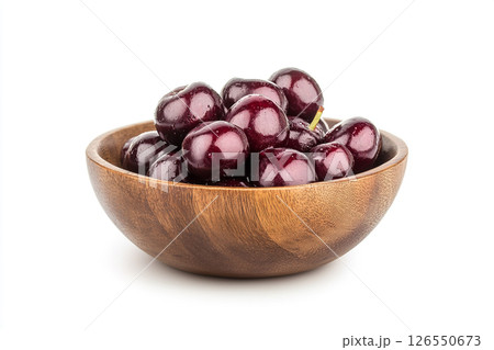 A wooden bowl filled with fresh, dark red cherries, each covered in water droplets, creating a visually appealing and appetizing image. 126550673