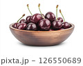A wooden bowl filled with fresh, dark red cherries, each covered in water droplets, creating a visually appealing and appetizing image. 126550689
