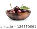 A wooden bowl filled with fresh, dark red cherries, each covered in water droplets, creating a visually appealing and appetizing image. 126550691
