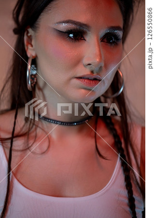 A stylish young woman showcases her unique makeup and fashionable looks, captivating all A stylish young woman showcases her unique makeup and fashionable looks, captivating all 126550866
