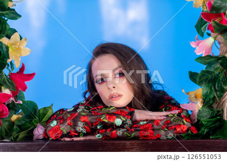 An Elegant Model Surrounded by Flowers, Set Against a Beautifully Dreamy Backdrop An Elegant Model Surrounded by Flowers, Set Against a Beautifully Dreamy Backdrop 126551053