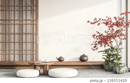A minimalist room with Japanese-inspired decor features a low wooden table, a tea set, and potted plants. Shoji screens allow soft natural light to fill the space. 126551420