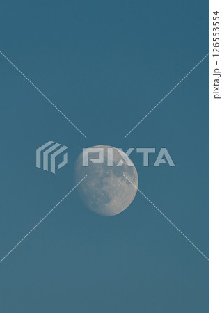 Almost full moon over a blue sky. Almost full moon over a blue sky. 126553554