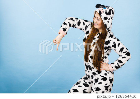 Woman wearing pajamas cartoon pointing down 126554410