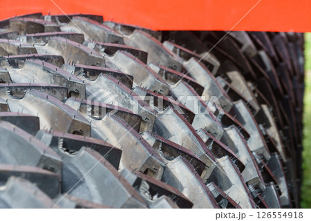 Detailed closeup of rubber tire wheel surface. Detailed closeup of rubber tire wheel surface. 126554918