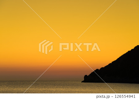 Sunset or sunrise over sea surface 126554941