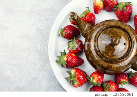 Red tea with strawberries. Red tea with strawberries. 126556061