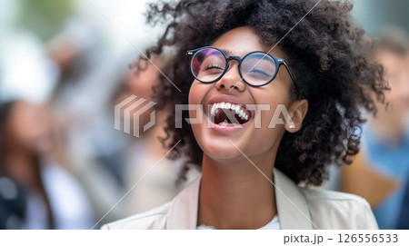 Laughing woman wearing glasses. 126556533