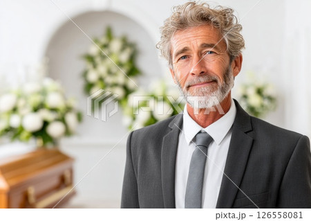 Friendly Senior Funeral Director with Warm Smile 126558081