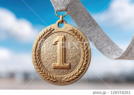 First Place Gold Medal Against Bright Sky Background 126558261
