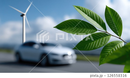 Close-up of green leaves with electric car and wind turbine in background Close-up of green leaves with electric car and wind turbine in background 126558316