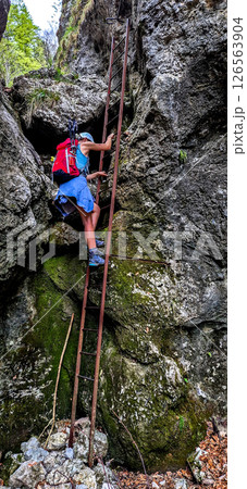 Young Woman On Via Ferrata With Ladder On Mountain Rax In The Alps In Austria 126563904