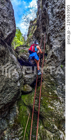 Young Woman On Via Ferrata With Ladder On Mountain Rax In The Alps In Austria 126563905