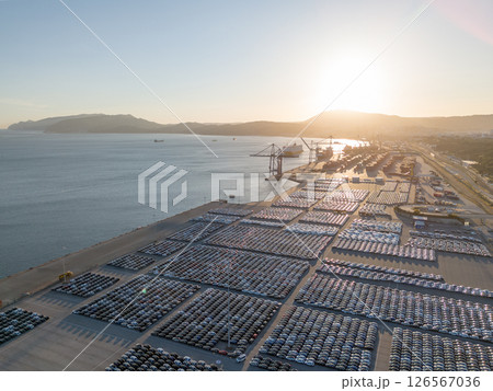 New Cars on Parking Lot in Port of Setubal, Portugal at Sunset. Aerial View New Cars on Parking Lot in Port of Setubal, Portugal at Sunset. Aerial View 126567036