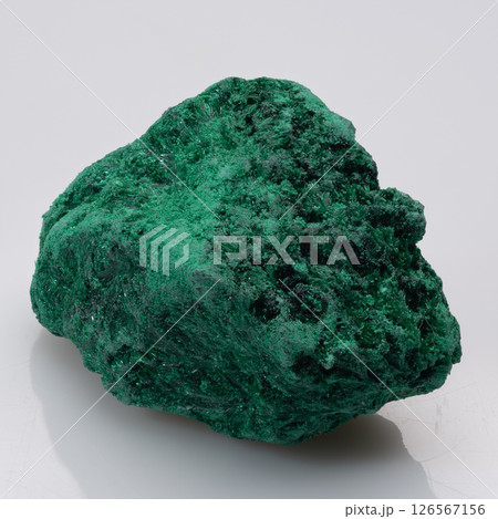 Captivating specimen of vibrant green malachite mineral, showcasing its intricate, botryoidal structure and lustrous surface a remarkable example of copper carbonate hydroxide formation 126567156