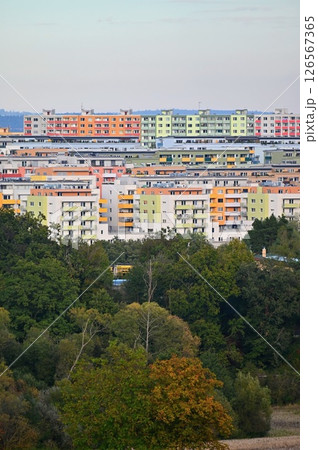 Original prefabricated houses on a housing estate from the communist era in Eastern and Central Europe after reconstruction.. Facade of a modern apartment building with windows and balconies. Czech 126567365