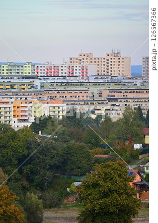 Original prefabricated houses on a housing estate from the communist era in Eastern and Central Europe after reconstruction.. Facade of a modern apartment building with windows and balconies. Czech Original prefabricated houses on a housing estate from the communist era in Eastern and Central Europe after reconstruction.. Facade of a modern apartment building with windows and balconies. Czech 126567366