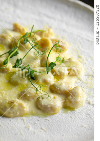 Portion of potato gnocchi with creamy sauce Portion of potato gnocchi with creamy sauce 126567520