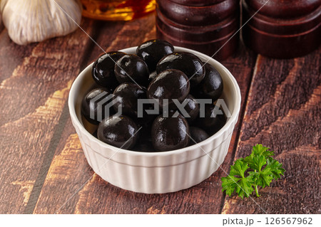 Mediterranean marinated Black olives in the bowl Mediterranean marinated Black olives in the bowl 126567962