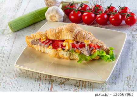 Croissant with tuna, tomato and salad 126567963