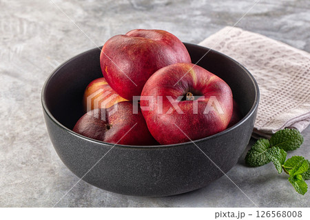 Ripe sweet juicy flat nectarines heap Ripe sweet juicy flat nectarines heap 126568008