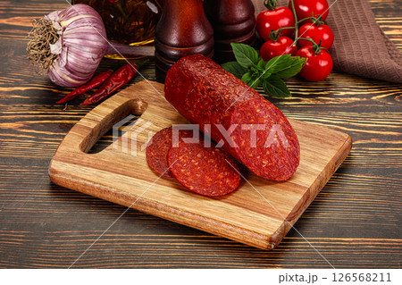 Spicy pepperoni sausages with sliced piece 126568211