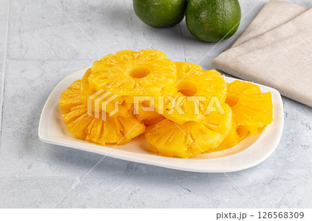 Sweet canned pineapple slices in syrope Sweet canned pineapple slices in syrope 126568309