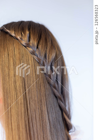 An Elegant Braided Hairstyle that Perfectly Aligns with Modern Fashion Trends and Styles 126568323