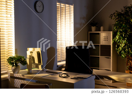 The modern office features natural lighting and a minimalistic design, boosting productivity 126568393