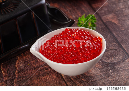 Salmon red caviar in the bowl 126568486