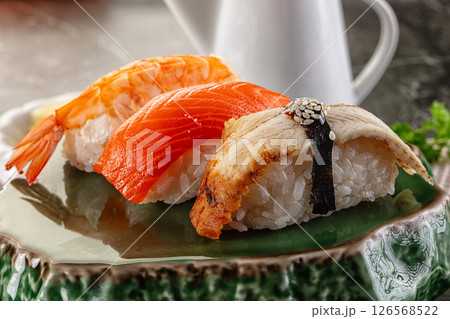 Japanese cuisine - sushi with eel, salmon and prawn 126568522