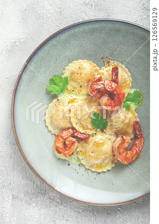 ravioli with shrimp, in cream sauce, with spices and herbs, top view, no people, 126569129