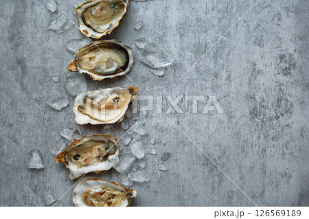 open fresh oysters stacked in a row open fresh oysters stacked in a row 126569189